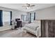 Bright bedroom with a queen-size bed, built-in desk, and plenty of natural light at 2225 Pleasant Hill Rd, Atlanta, GA 30349