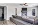 Living room with gray sectional sofa and fireplace at 2225 Pleasant Hill Rd, Atlanta, GA 30349