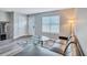 Living room with L-shaped sofa and glass coffee table at 2225 Pleasant Hill Rd, Atlanta, GA 30349