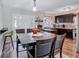 Kitchen with dark cabinets, tiled backsplash, and breakfast bar at 2225 Pleasant Hill Rd, Atlanta, GA 30349