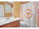 Bathroom with tub/shower combo and a Texas Longhorns shower curtain at 1565 Mountain Shadow Trl, Stone Mountain, GA 30087
