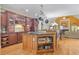 Open concept kitchen boasts a large island, stainless steel appliances, and hardwood floors at 1565 Mountain Shadow Trl, Stone Mountain, GA 30087