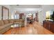 Open Gathering room with hardwood floors and kitchen views at 1565 Mountain Shadow Trl, Stone Mountain, GA 30087
