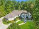 Large home with a wraparound porch and beautifully landscaped yard at 1565 Mountain Shadow Trl, Stone Mountain, GA 30087