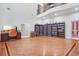 Bright library with hardwood floors, built-in shelves, and high ceilings at 1565 Mountain Shadow Trl, Stone Mountain, GA 30087