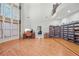 Spacious library with hardwood floors, built-in bookshelves, and a home office at 1565 Mountain Shadow Trl, Stone Mountain, GA 30087