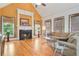 Gathering room with hardwood floors, fireplace, and large windows at 1565 Mountain Shadow Trl, Stone Mountain, GA 30087