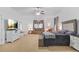 Large main bedroom with seating area and plush carpet at 1565 Mountain Shadow Trl, Stone Mountain, GA 30087