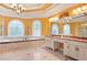 Elegant bathroom with double vanity, garden tub, and large windows at 1565 Mountain Shadow Trl, Stone Mountain, GA 30087