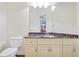 Guest bathroom with marble countertop and white cabinets at 1565 Mountain Shadow Trl, Stone Mountain, GA 30087
