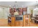 Gourmet kitchen features granite counters, large island, and ample cabinetry at 1565 Mountain Shadow Trl, Stone Mountain, GA 30087