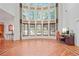 Two-story great room with wall of windows and hardwood floors at 1565 Mountain Shadow Trl, Stone Mountain, GA 30087