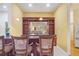 Breakfast bar with granite countertop and wood cabinetry at 1565 Mountain Shadow Trl, Stone Mountain, GA 30087