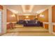 Finished basement home theater with built-in seating and lighting at 1565 Mountain Shadow Trl, Stone Mountain, GA 30087