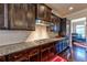 Modern kitchen with dark wood cabinets and white subway tile backsplash at 3517 Village Park Nw Way, Kennesaw, GA 30144