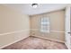 Bright bedroom featuring a window with blinds and neutral decor at 139 Old Mill Sw Trl, Conyers, GA 30094
