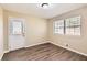 Bedroom with door to exterior and vinyl flooring at 139 Old Mill Sw Trl, Conyers, GA 30094