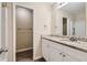 Bathroom with granite countertop and white cabinets at 139 Old Mill Sw Trl, Conyers, GA 30094