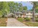 House exterior with carport and landscaped yard at 139 Old Mill Sw Trl, Conyers, GA 30094