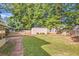 Private backyard with storage shed and grassy area at 139 Old Mill Sw Trl, Conyers, GA 30094