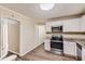 Kitchen with stainless steel appliances and granite countertops at 139 Old Mill Sw Trl, Conyers, GA 30094