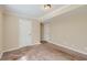 Simple bedroom with neutral walls and carpet flooring at 139 Old Mill Sw Trl, Conyers, GA 30094