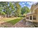 Large backyard with patio, grass area and mature trees at 139 Old Mill Sw Trl, Conyers, GA 30094