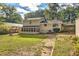House exterior showcasing a screened porch and large backyard at 139 Old Mill Sw Trl, Conyers, GA 30094