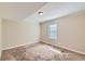 Well-lit bedroom with neutral walls and carpet flooring at 139 Old Mill Sw Trl, Conyers, GA 30094