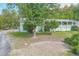 View of the home from the side yard, showing the covered porch at 4310 Bryan Se Ln, Acworth, GA 30102