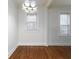 Bright dining room with hardwood floors and large windows at 242 12Th Ne St # 8, Atlanta, GA 30309