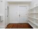 Simple entryway with white shelving and hardwood floors at 242 12Th Ne St # 8, Atlanta, GA 30309