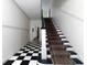 Elegant staircase with a black and white checkered floor at 242 12Th Ne St # 8, Atlanta, GA 30309