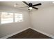 Spacious bedroom with dark hardwood floors and ceiling fan at 662 Gary Nw Rd, Atlanta, GA 30318