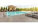 Community swimming pool with lounge chairs at 230 E Ponce De Leon Ave # 314, Decatur, GA 30030