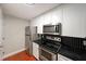 Kitchen with stainless steel appliances and white cabinets at 230 E Ponce De Leon Ave # 314, Decatur, GA 30030