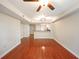 Hardwood floor living room with ceiling fan and kitchen bar at 230 E Ponce De Leon Ave # 314, Decatur, GA 30030