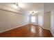 Hardwood floor living room with ceiling fan and access to patio at 230 E Ponce De Leon Ave # 314, Decatur, GA 30030