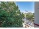 Balcony view of street scene with trees and flag at 230 E Ponce De Leon Ave # 314, Decatur, GA 30030