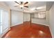 Living room with hardwood floors, kitchen bar and patio access at 230 E Ponce De Leon Ave # 314, Decatur, GA 30030