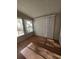 Sunroom with wood-look flooring and window blinds at 2977 Cascade Manor Dr, Decatur, GA 30034