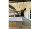 Outdoor kitchen with built-in cabinets and ceiling fan at 2735 Sandy Creek Cir, Loganville, GA 30052