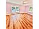 Bright bedroom with light purple walls and wood-look floors at 2735 Sandy Creek Cir, Loganville, GA 30052