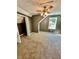 Spacious bedroom with carpet, ceiling fan, and ample closet space at 2735 Sandy Creek Cir, Loganville, GA 30052
