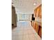 Bright dining area with tile floors and kitchen access at 2735 Sandy Creek Cir, Loganville, GA 30052
