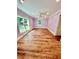 Bright bedroom with light purple walls and wood-look floors at 2735 Sandy Creek Cir, Loganville, GA 30052