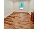 Spacious bedroom with wood-look floors and large window at 2735 Sandy Creek Cir, Loganville, GA 30052