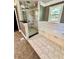 Walk-in shower with glass enclosure and built-in seat at 2735 Sandy Creek Cir, Loganville, GA 30052