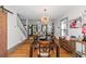 Dining area with hardwood floors, modern chandelier, and barn door at 1688 Richland Sw Rd, Atlanta, GA 30311