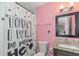Small bathroom with pink walls and granite vanity at 1688 Richland Sw Rd, Atlanta, GA 30311